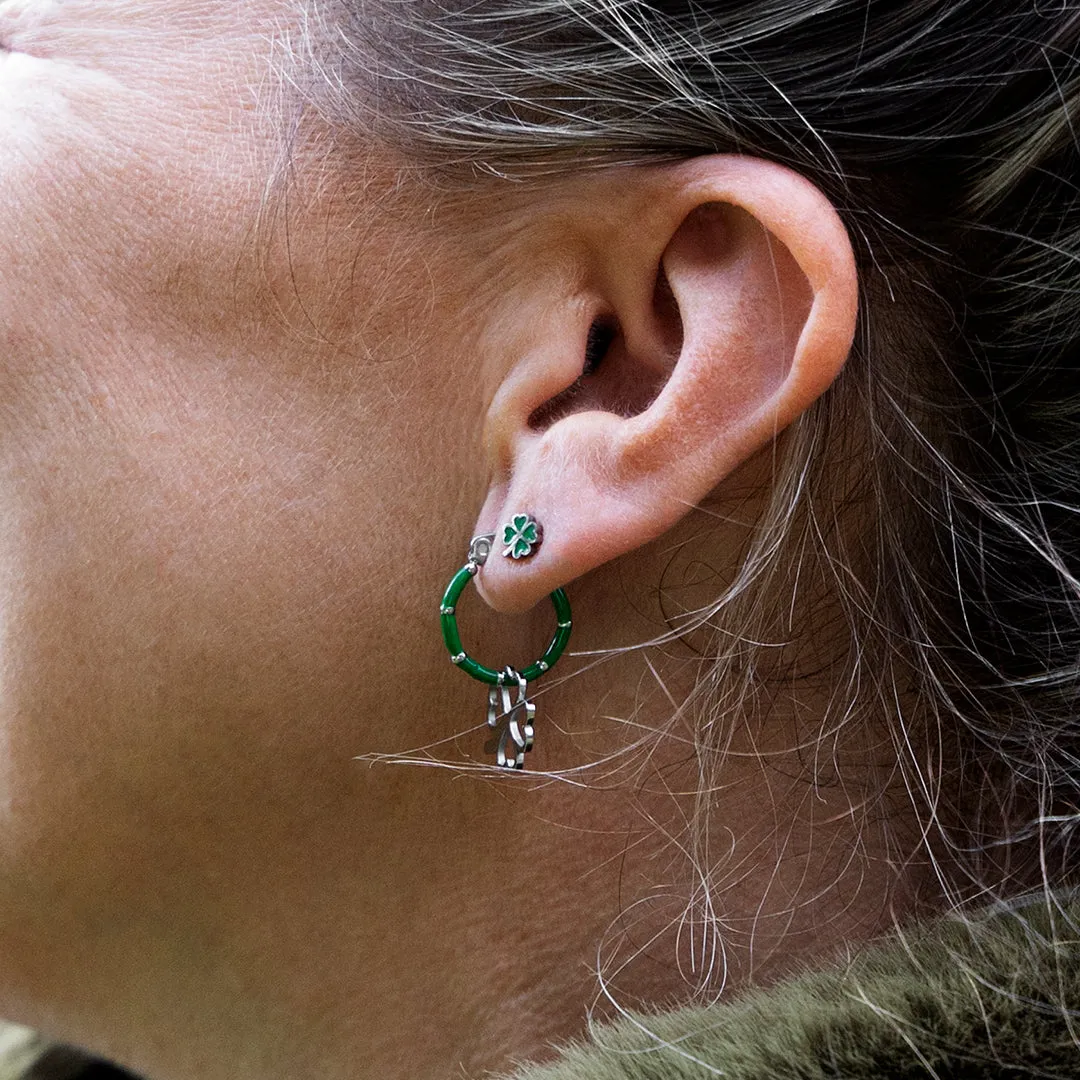 Silver coloured/green stud earrings with a green clover